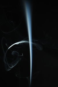 Close-up of light painting over black background