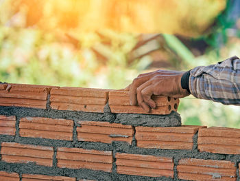 Low angle view of people on wall