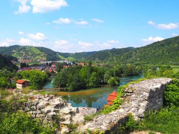 Scenic view of lake and mountains against sky
