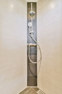 Low angle view of shower head in bathroom