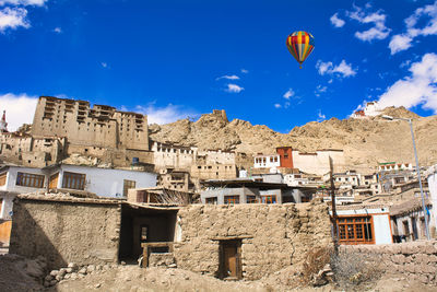 Low angle view of hot air balloons against sky