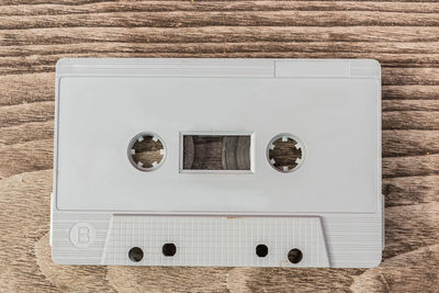 High angle view of cassette on wooden table