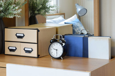 Close-up of alarm clock on table