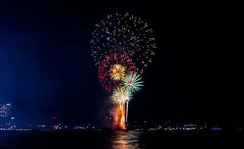 Firework display at night