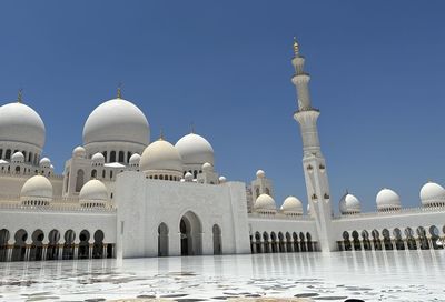 Low angle view of mosque against clear sky