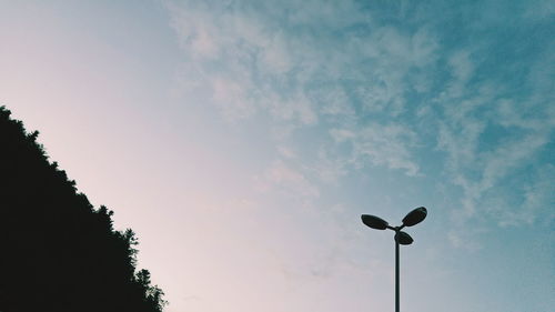 Low angle view of street light against sky