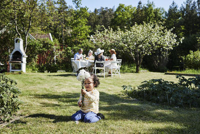 Rear view of women sitting at park