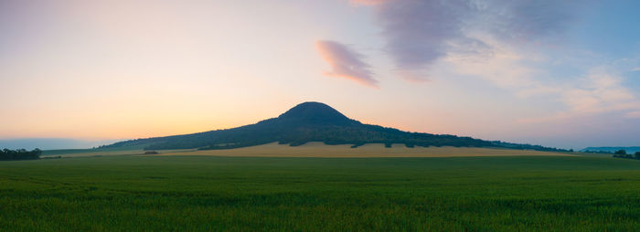 Scenic view of landscape against sky during sunset