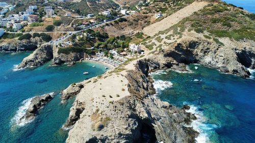 High angle view of rocks on sea shore