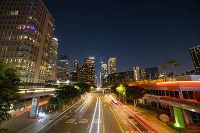 Los angeles at night with car trails leading down the streets