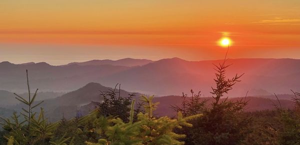 Scenic view of mountains against sky during sunset