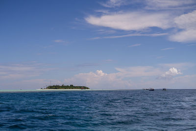 Dark blue and turquoise green with small island in semporna, borneo, sabah.