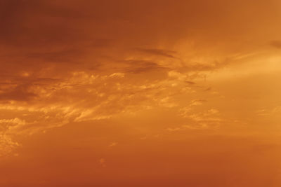 Low angle view of dramatic sky during sunset