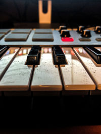 Close-up of piano keys on table