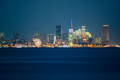 Illuminated buildings in city at night