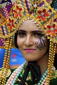 Close-up portrait of smiling young woman