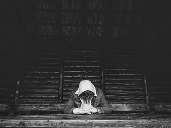 Woman sitting with umbrella