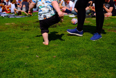 Low section of people on grass