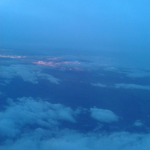 blue, scenics, beauty in nature, tranquil scene, tranquility, sky, nature, aerial view, copy space, idyllic, sky only, cloud - sky, cloudscape, majestic, outdoors, no people, cloud, sea, day, white color