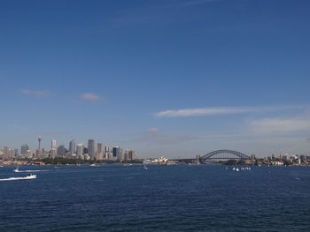 City at waterfront against sky