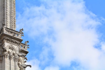 Low angle view of statue against cloudy sky