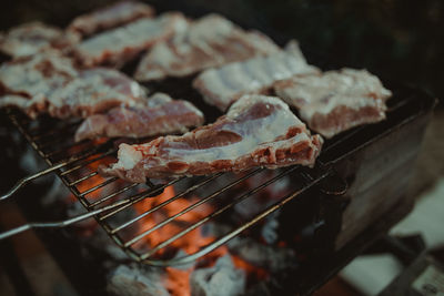 Close-up of meat on barbecue grill