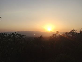 Scenic view of silhouette landscape against sky during sunset