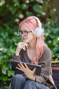 Young woman using mobile phone