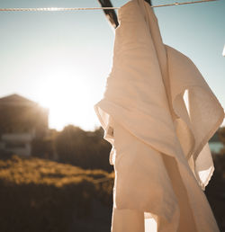 Close-up of man against sky during sunset