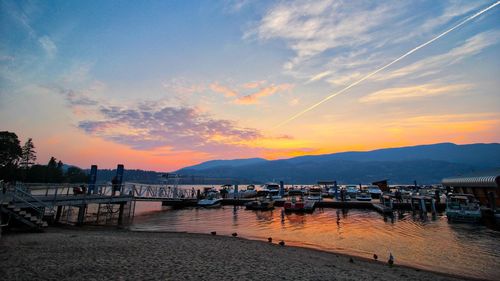 Scenic view of pier at sunset