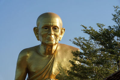 Low angle view of statue against sky