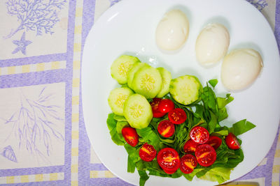 High angle view of fruits in plate on table