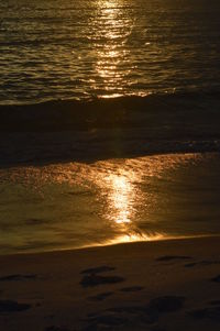 Close-up of sea against sky during sunset