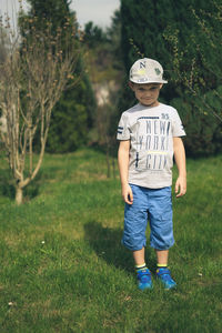 Full length of boy standing on field