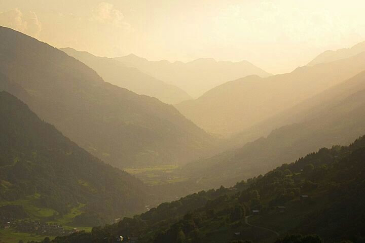 mountain, tranquil scene, tranquility, scenics, mountain range, landscape, beauty in nature, nature, non-urban scene, sunset, idyllic, fog, sky, remote, silhouette, outdoors, copy space, no people, non urban scene