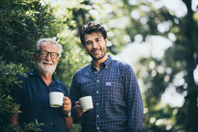 Portrait of young man drinking coffee