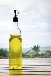 Close-up of olive oil on table