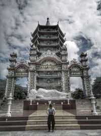 Rear view of man against building