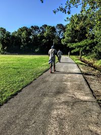 Full length of woman walking on footpath