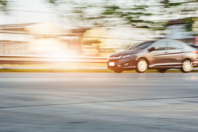 Blurred motion of car moving on road