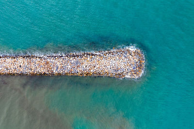 High angle view of groyne on sea