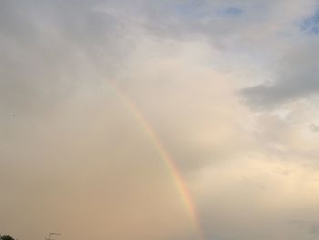 Low angle view of rainbow in sky
