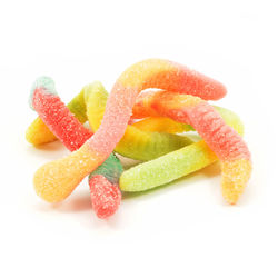 Close-up of multi colored candies against white background