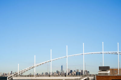 Suspension bridge against blue sky