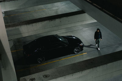 High angle view of man walking in city