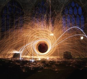 Spiral wire wool against wall at night