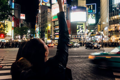 People on street in city at night