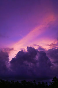 Low angle view of dramatic sky during sunset