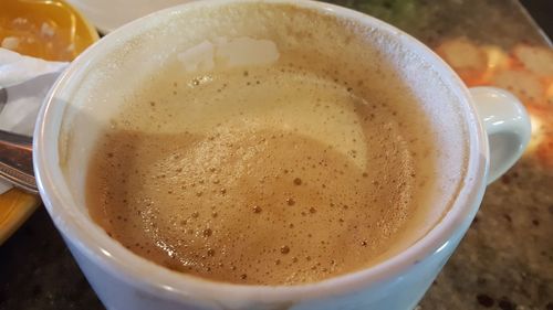 High angle view of cappuccino on table