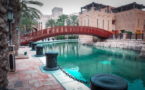 View of swimming pool by buildings